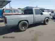 1990 Nissan Frontier z VIN 1N6SD11S9LC321876, wystawiony jako Copart lot #59913575 z przebiegiem 119 909 mil mil oraz Szkoda całkowita • Salvage title. Historia ofert i sprzedaży dostępna na DreamBid. Obrazek 3.