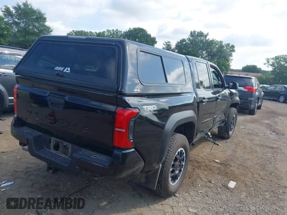 2024 Toyota Tacoma SR5 with VIN 3TMLB5JN4RM054958, listed as a IAAI auction lot 43047601 with 15,429 mi miles and . Bid and sale history available at DreamBid. Image 4.