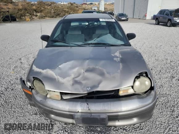 1998 Dodge Neon Highline with VIN 1B3ES42C2WD642821, listed as a Copart auction lot 77038094 with 86,992 mi miles and Salvage title. Bid and sale history available at DreamBid. Image 5.