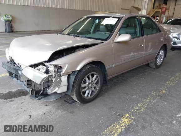 2001 Toyota Camry LE z VIN 4T1BF28K11U960653, wystawiony jako IAAI lot #43200279 z przebiegiem 210 647 mil mil oraz . Historia ofert i sprzedaży dostępna na DreamBid. Obrazek 18.