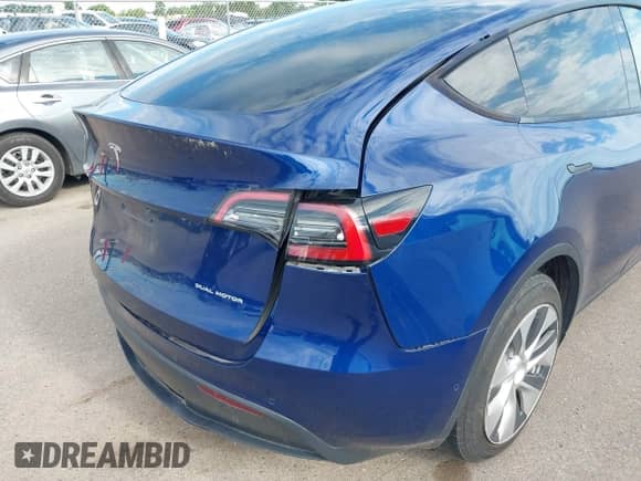 2021 Tesla Model Y Long Range with VIN 5YJYGDEE8MF187196, listed as a IAAI auction lot 42615790 with 89,810 mi miles and . Bid and sale history available at DreamBid. Image 6.