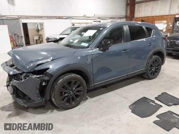 2022 Mazda CX-5 S Preferred z VIN JM3KFBCM1N0551165, wystawiony jako IAAI lot #42277023 z przebiegiem 34 115 mil mil oraz . Historia ofert i sprzedaży dostępna na DreamBid. Obrazek 2.