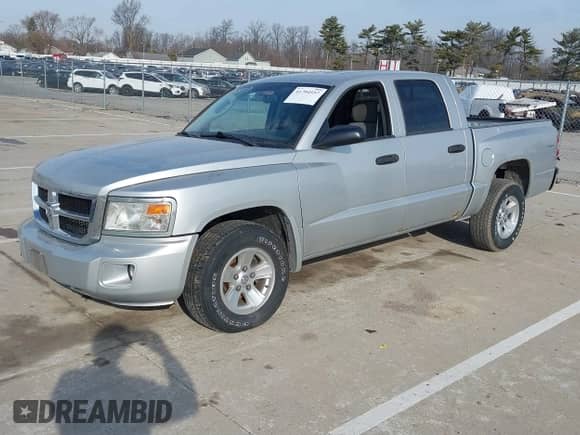 2008 Dodge Dakota SLT with VIN 1D7HW48N08S626761, listed as a IAAI auction lot 41794557 with 104,195 mi miles and . Bid and sale history available at DreamBid. Image 2.