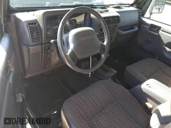 2000 Jeep Wrangler Sport with VIN 1J4FA49S1YP796600, listed as a Copart auction lot 82574545 with 128,340 mi miles and Clean title. Bid and sale history available at DreamBid. Image 8.