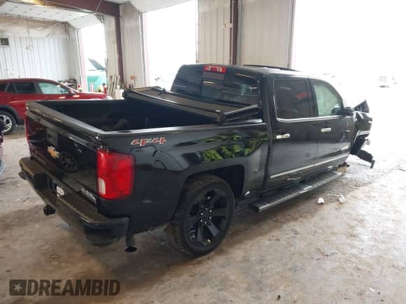 2017 Chevrolet Silverado 1500 High Country with VIN 3GCUKTECXHG409985, listed as a IAAI auction lot 43304925 with 179,299 mi miles and . Bid and sale history available at DreamBid. Image 4.