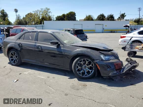 2015 Chrysler 300 S with VIN 2C3CCABT6FH864478, listed as a Copart auction lot 69117335 with 162,412 mi miles and Salvage title. Bid and sale history available at DreamBid. Image 4.