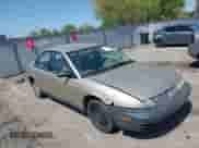 1996 Saturn SL z VIN 1G8ZH5288TZ230864, wystawiony jako IAAI lot #42116703 z przebiegiem 104 387 mil mil oraz . Historia ofert i sprzedaży dostępna na DreamBid. Obrazek 1.