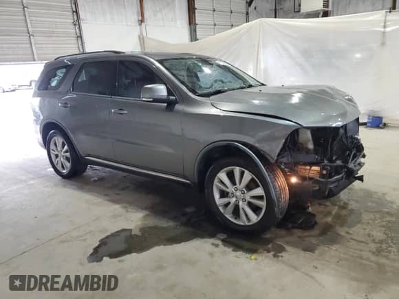 2012 Dodge Durango Crew with VIN 1C4RDJDG7CC163398, listed as a Copart auction lot 81640595 with 123,839 mi miles and Salvage title. Bid and sale history available at DreamBid. Image 4.