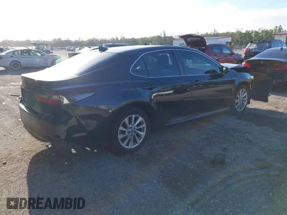 2021 Toyota Camry LE with VIN 4T1C11AK2MU472694, listed as a IAAI auction lot 43340745 with 61,965 mi miles and . Bid and sale history available at DreamBid. Image 4.