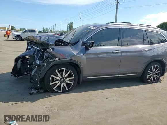 2021 Honda Pilot Touring 8-Passenger z VIN 5FNYF6H94MB034392, wystawiony jako Copart lot #68621825 z przebiegiem Nie podano mil oraz Nie do naprawy • Non repairable. Historia ofert i sprzedaży dostępna na DreamBid. Obrazek 14.