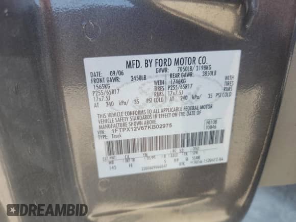 2007 Ford F-150 XL with VIN 1FTPX12V67KB02975, listed as a Copart auction lot 80307185 with 129,442 mi miles and Salvage title. Bid and sale history available at DreamBid. Image 12.