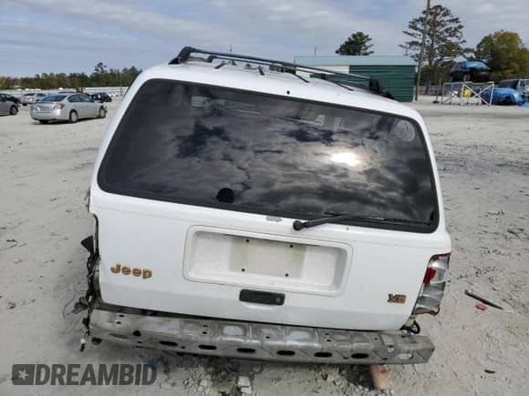 1995 Jeep Grand Cherokee Limited with VIN 1J4GZ78Y2SC788413, listed as a Copart auction lot 80297444 with 309,566 mi miles and Salvage title. Bid and sale history available at DreamBid. Image 6.
