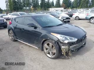 2013 Hyundai Veloster Turbo с VIN KMHTC6AE3DU158036, выставлен на аукционе IAAI как лот 43401490 с пробегом 142 089 миль миль и . История ставок и продаж доступна на DreamBid. Изображение 1.