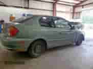 2005 Hyundai Accent GLS z VIN KMHCG35CX5U335467, wystawiony jako Copart lot #61091895 z przebiegiem Nie podano mil oraz Szkoda całkowita • Salvage title. Historia ofert i sprzedaży dostępna na DreamBid. Obrazek 3.