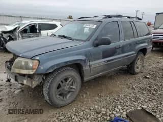 2003 Jeep Grand Cherokee Laredo with VIN 1J4GW48S33C612166, listed as a Copart auction lot 86490125 with 194,577 mi miles and Non repairable. Bid and sale history available at DreamBid. Image 1.