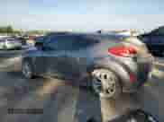 2013 Hyundai Veloster w/Black Int z VIN KMHTC6AD1DU130100, wystawiony jako Copart lot #83947425 z przebiegiem 155 402 mil mil oraz Szkoda całkowita • Salvage title. Historia ofert i sprzedaży dostępna na DreamBid. Obrazek 2.