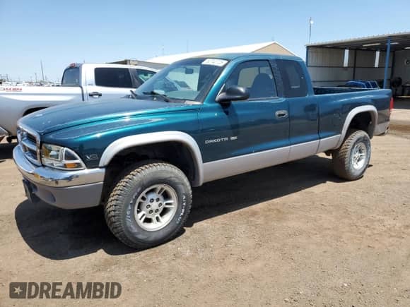 1999 Dodge Dakota SLT z VIN 1B7GG22Y6XS255372, wystawiony jako Copart lot #60740725 z przebiegiem 134 980 mil mil oraz Szkoda całkowita • Salvage title. Historia ofert i sprzedaży dostępna na DreamBid. Obrazek 1.