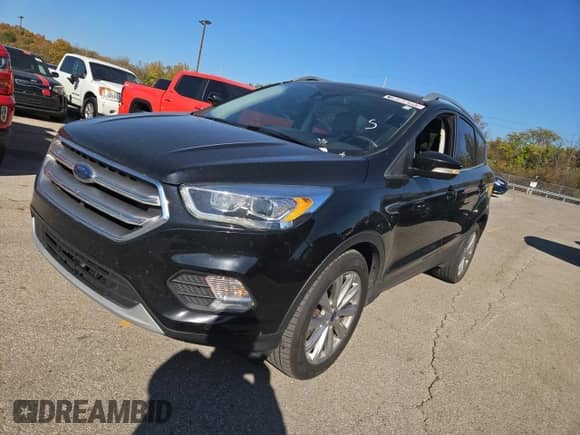 2017 Ford Escape Titanium с VIN 1FMCU9JD7HUB88314, выставлен на аукционе Copart как лот 90627415 с пробегом 165 953 миль миль и Чистый • Clean title. История ставок и продаж доступна на DreamBid. Изображение 2.