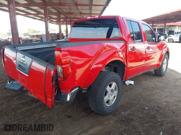 2008 Nissan Frontier SE with VIN 1N6AD07UX8C404996, listed as a IAAI auction lot 43005440 with 242,512 mi miles and . Bid and sale history available at DreamBid. Image 4.