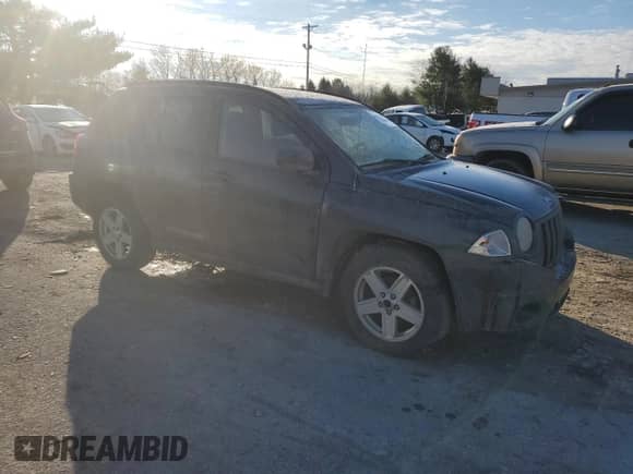 2010 Jeep Compass Sport z VIN 1J4NT1FB8AD671108, wystawiony jako Copart lot #82151454 z przebiegiem 206 413 mil mil oraz Szkoda całkowita • Salvage title. Historia ofert i sprzedaży dostępna na DreamBid. Obrazek 4.