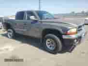 2002 Dodge Dakota SLT with VIN 1B7HG48N02S633708, listed as a Copart auction lot 80820345 with 182,965 mi miles and Salvage title. Bid and sale history available at DreamBid. Image 4.