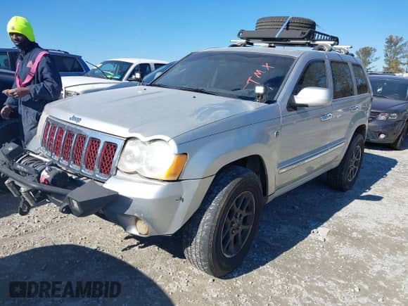 2009 Jeep Grand Cherokee with VIN 1J8HR68T39C540795, listed as a IAAI auction lot 41379112 with 236,624 mi miles and . Bid and sale history available at DreamBid. Image 2.