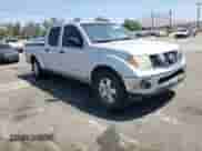 2007 Nissan Frontier SE z VIN 1N6AD09U87C423526, wystawiony jako Copart lot #69788424 z przebiegiem 209 736 mil mil oraz Szkoda całkowita • Salvage title. Historia ofert i sprzedaży dostępna na DreamBid. Obrazek 11.
