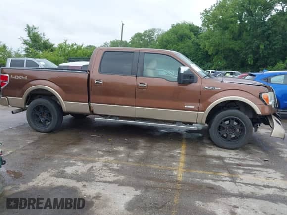 2011 Ford F-150 XLT z VIN 1FTFW1ET3BFA97549, wystawiony jako IAAI lot #42345418 z przebiegiem 189 105 mil mil oraz . Historia ofert i sprzedaży dostępna na DreamBid. Obrazek 14.