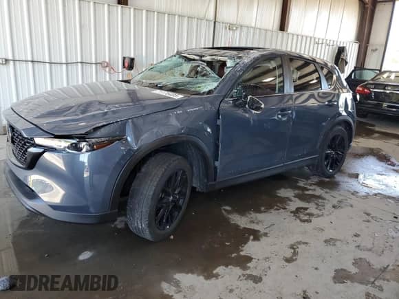 2022 Mazda CX-5 S Carbon Edition z VIN JM3KFBCM3N0639523, wystawiony jako Copart lot #71176405 z przebiegiem 23 821 mil mil oraz Szkoda całkowita • Salvage title. Historia ofert i sprzedaży dostępna na DreamBid. Obrazek 1.