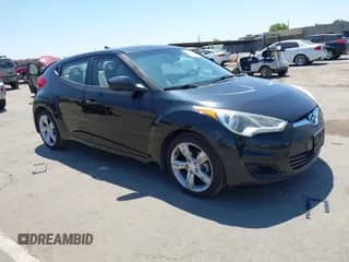 2013 Hyundai Veloster w/Black Int z VIN KMHTC6AD2DU144376, wystawiony jako IAAI lot #42720882 z przebiegiem 143 023 mil mil oraz . Historia ofert i sprzedaży dostępna na DreamBid. Obrazek 1.