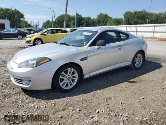 2008 Hyundai Tiburon GS с VIN KMHHM66D88U292212, выставлен на аукционе Copart как лот 61728975 с пробегом 129 358 миль миль и Чистый • Clean title. История ставок и продаж доступна на DreamBid. Изображение 1.