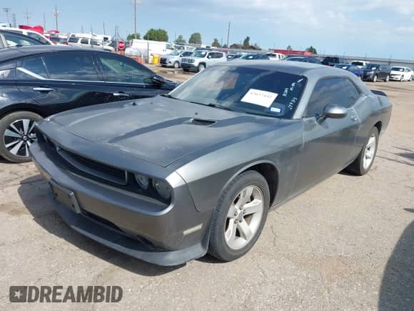 2012 Dodge Challenger SXT Plus with VIN 2C3CDYAG3CH254513, listed as a IAAI auction lot 42637442 with 104,659 mi miles and . Bid and sale history available at DreamBid. Image 2.