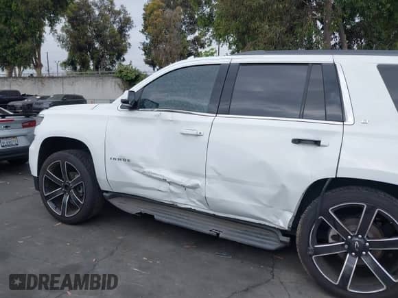 2018 Chevrolet Tahoe LT z VIN 1GNSCBKC1JR206967, wystawiony jako IAAI lot #42565511 z przebiegiem Nie podano mil oraz . Historia ofert i sprzedaży dostępna na DreamBid. Obrazek 14.
