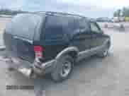 1999 Chevrolet Blazer LT z VIN 1GNCS13W1X2169673, wystawiony jako IAAI lot #42778174 z przebiegiem 127 038 mil mil oraz . Historia ofert i sprzedaży dostępna na DreamBid. Obrazek 4.