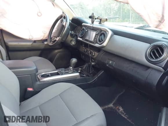 2018 Toyota Tacoma SR with VIN 5TFRX5GN8JX117075, listed as a IAAI auction lot 41723001 with 67,559 mi miles and . Bid and sale history available at DreamBid. Image 5.