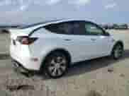 2023 Tesla Model Y Long Range with VIN 7SAYGDEE8PA068598, listed as a Copart auction lot 84741425 with 53,598 mi miles and Salvage title. Bid and sale history available at DreamBid. Image 3.