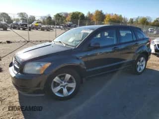 2010 Dodge Caliber SXT with VIN 1B3CB4HA9AD635046, listed as a Copart auction lot 82397075 with 190,652 mi miles and Salvage title. Bid and sale history available at DreamBid. Image 1.