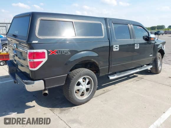 2013 Ford F-150 Lariat with VIN 1FTFW1ET3DKE67750, listed as a IAAI auction lot 43240995 with 159,269 mi miles and . Bid and sale history available at DreamBid. Image 4.