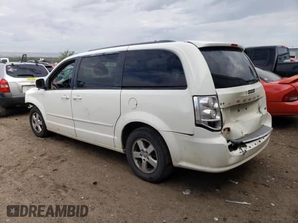 2013 Dodge Grand Caravan SXT with VIN 2C4RDGCG6DR575826, listed as a Copart auction lot 57378454 with 169,953 mi miles and Salvage title. Bid and sale history available at DreamBid. Image 2.