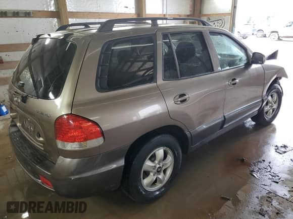 2005 Hyundai Santa Fe GLS z VIN KM8SC73D45U972784, wystawiony jako Copart lot #80883594 z przebiegiem Nie podano mil oraz Szkoda całkowita • Salvage title. Historia ofert i sprzedaży dostępna na DreamBid. Obrazek 3.