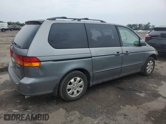 2002 Honda Odyssey EX с VIN 5FNRL186X2B025473, выставлен на аукционе Copart как лот 84551975 с пробегом 180 720 миль миль и Списание • Salvage title. История ставок и продаж доступна на DreamBid. Изображение 3.