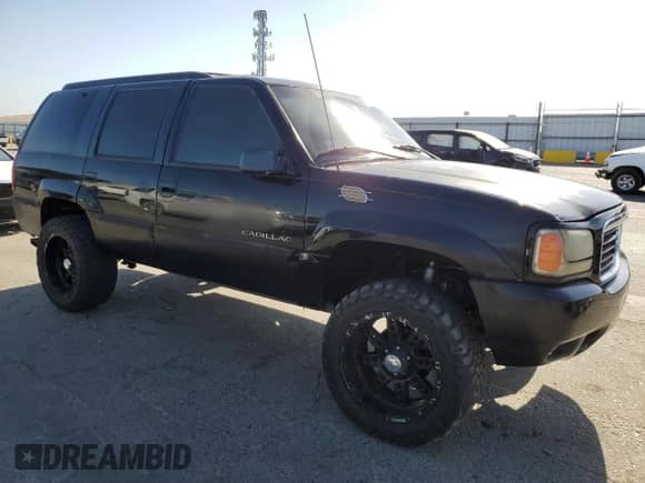 2000 Cadillac Escalade z VIN 1GYEK13R4YR103293, wystawiony jako Copart lot #58673244 z przebiegiem Nie podano mil oraz Nie do naprawy • Non repairable. Historia ofert i sprzedaży dostępna na DreamBid. Obrazek 4.