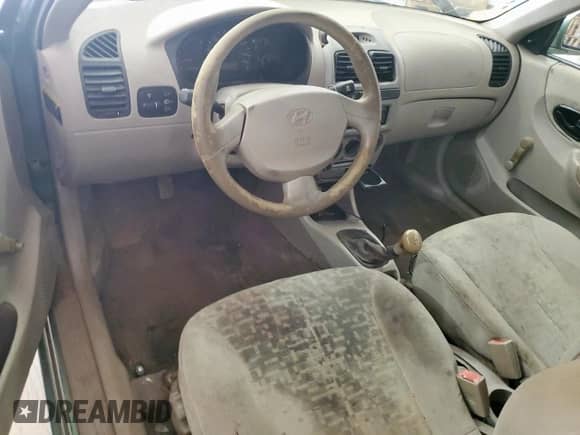 2005 Hyundai Accent GLS z VIN KMHCG35CX5U335467, wystawiony jako Copart lot #61091895 z przebiegiem Nie podano mil oraz Szkoda całkowita • Salvage title. Historia ofert i sprzedaży dostępna na DreamBid. Obrazek 8.