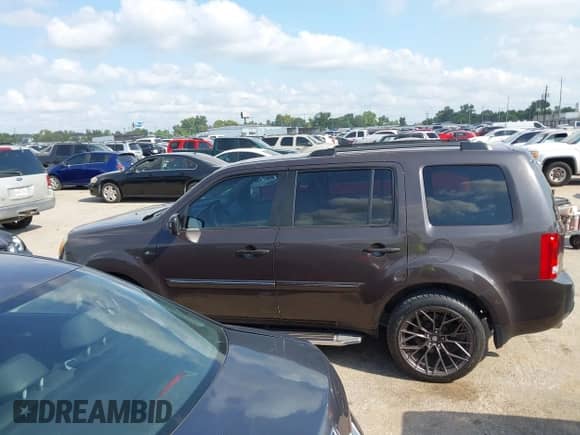 2013 Honda Pilot EX-L with VIN 5FNYF3H54DB024750, listed as a IAAI auction lot 43156830 with 107,550 mi miles and . Bid and sale history available at DreamBid. Image 14.