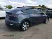 2021 Tesla Model Y Long Range with VIN 5YJYGDEE5MF257320, listed as a Copart auction lot 63980974 with 89,016 mi miles and Salvage title. Bid and sale history available at DreamBid. Image 3.