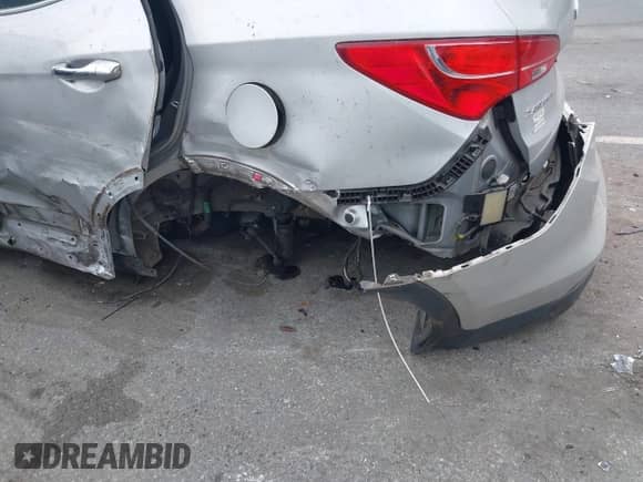 2014 Hyundai Santa Fe with VIN 5XYZU3LA2EG173067, listed as a IAAI auction lot 43309222 with 136,499 mi miles and . Bid and sale history available at DreamBid. Image 6.