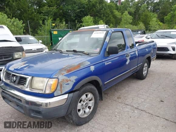 1999 Nissan Frontier XE with VIN 1N6DD26S5XC319085, listed as a IAAI auction lot 42469039 with 59,251 mi miles and . Bid and sale history available at DreamBid. Image 2.