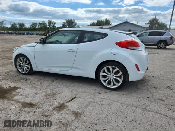 2015 Hyundai Veloster with VIN KMHTC6AD3FU229648, listed as a Copart auction lot 69972395 with 107,024 mi miles and Salvage title. Bid and sale history available at DreamBid. Image 2.