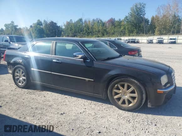 2009 Chrysler 300 C Hemi with VIN 2C3KA63T19H571475, listed as a Copart auction lot 80807015 with 142,846 mi miles and Salvage title. Bid and sale history available at DreamBid. Image 4.