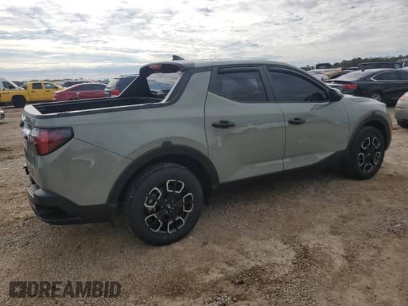 2023 Hyundai Santa Cruz SE с VIN 5NTJA4AEXPH069571, выставлен на аукционе Copart как лот 88413245 с пробегом 22 035 миль миль и На запчасти • Non repairable. История ставок и продаж доступна на DreamBid. Изображение 3.